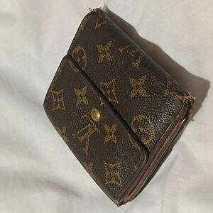 Louis Vuitton Monogram Double Snap Wallet.